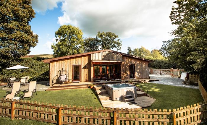 Sycamore Lodge fenced and secure garden with parking and storage shed.